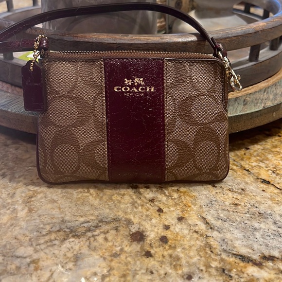 Coach wristlet wallet. Dark brown maroon leather and Coach logo design. - Picture 2 of 5